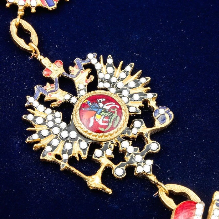 The Order of St. A. the First-Called on a chain with rhinestones under glass